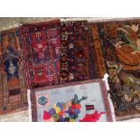 ASSORTED ORIENTAL SMALL TRIBAL RUGS including a Chikarghh abstract landscape rug, Baluch prayer rug,