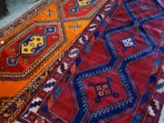 TWO TRIBAL NARROW RUGS both Qashqais, one with orange field, largest 325 x 125cms (2) Condition