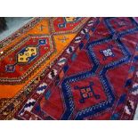 TWO TRIBAL NARROW RUGS both Qashqais, one with orange field, largest 325 x 125cms (2) Condition