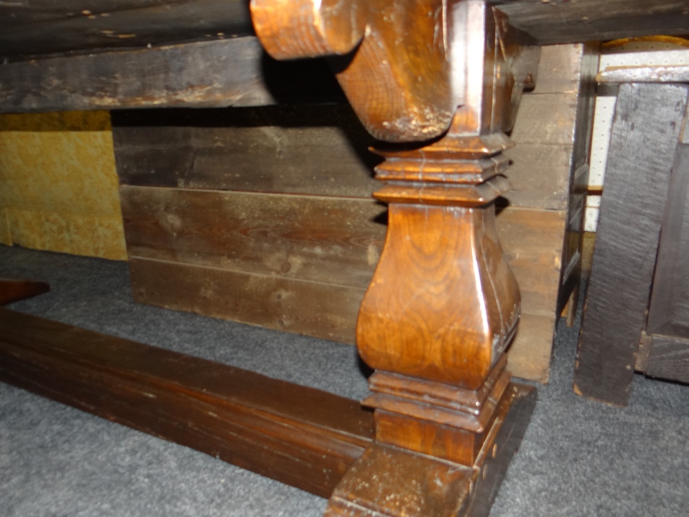 ANTIQUE ELM REFECTORY TABLE the four plank top with cleated ends on square baluster trestle end - Image 3 of 15