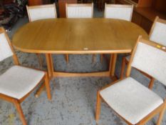 MID-CENTURY DANISH TEAK EXTENDING DINING TABLE BY SKOVBY with two extra leaves, together with set of