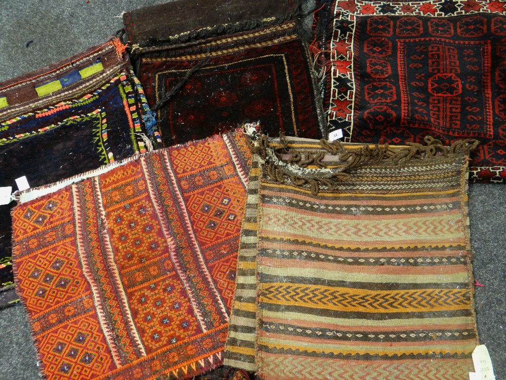 ASSORTED ORIENTAL TRIBAL SADDLE BAGS including two Soumak woven examples (5) Condition Report :