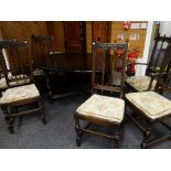 AN ERCOL STAINED ELM ELIZABETHAN-STYLE DINING SUITE comprising high dresser, oval extending dining