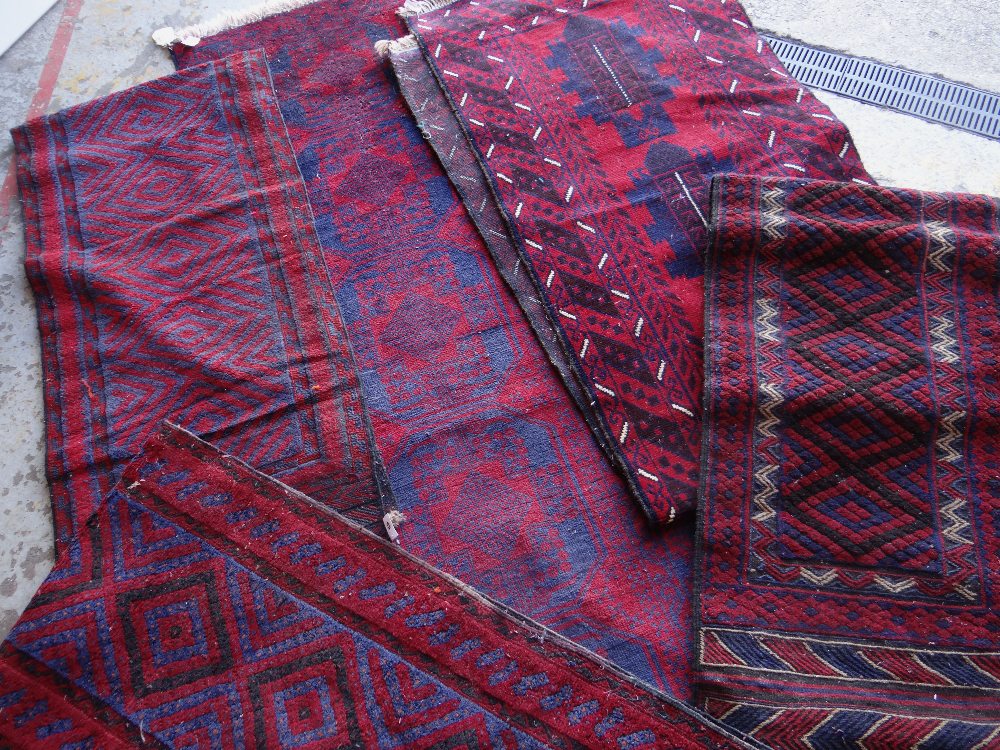 ASSORTED TRIBAL RUNNERS OR STAIR CARPETS including a Baluch (5) Condition Report: all with insect
