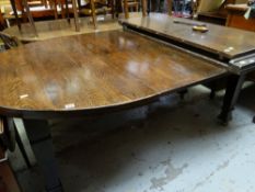 ARTS & CRAFTS STAINED ELM EXTENDING DINING TABLE with three extra leaves overall, 200cms long