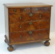 QUEEN ANNE WALNUT CHEST, moulded top and five graduated drawers with cross banded fronts, bun