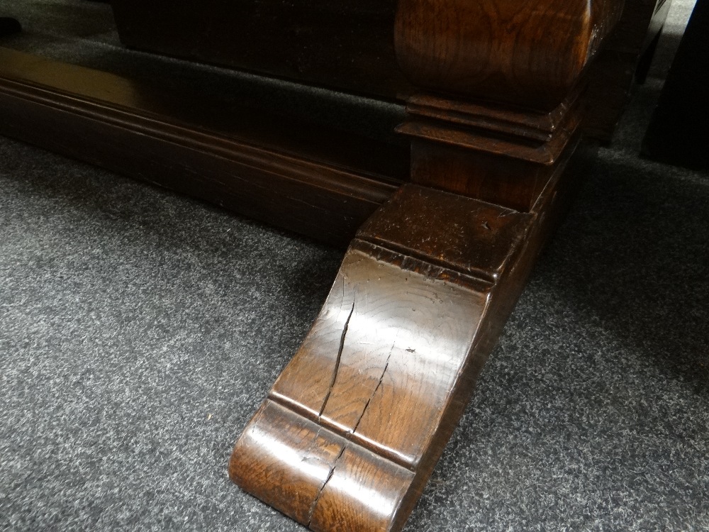 ANTIQUE ELM REFECTORY TABLE the four plank top with cleated ends on square baluster trestle end - Image 5 of 15