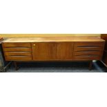 MID-CENTURY TEAK SIDEBOARD central cupboard between sets of drawers, 221 x 45.5 x 73cms