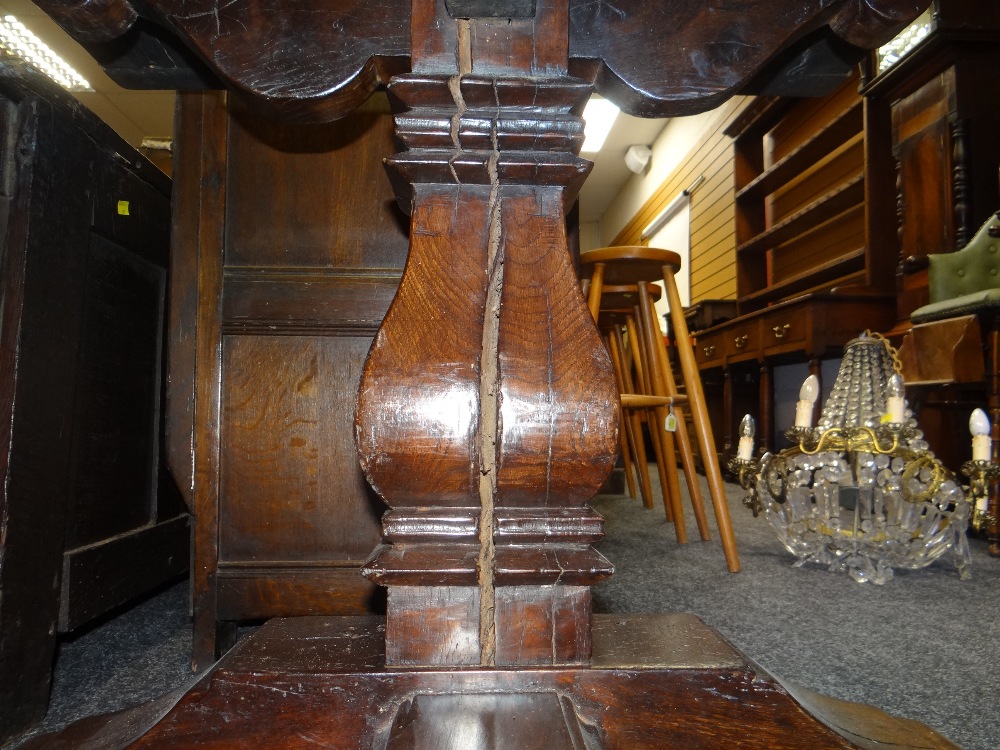 ANTIQUE ELM REFECTORY TABLE the four plank top with cleated ends on square baluster trestle end - Image 14 of 15