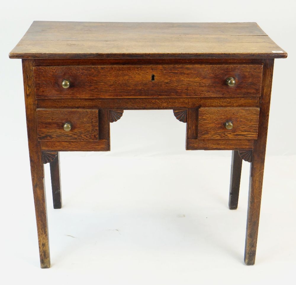 18TH CENTURY OAK LOWBOY, fitted three drawers, carved fan shaped spandrels, 83cms wide