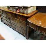 REPRODUCTION GEORGIAN-STYLE MAHOGANY CROSSBANDED NINE-DRAWER CHEST, 153cms wide and a reproduction