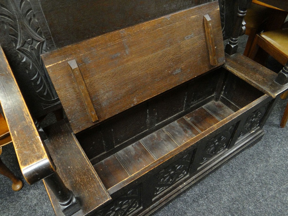 17TH CENTURY-STYLE CARVED OAK MONKS BENCH carved top and hinged box base, 122cms wide - Image 3 of 4