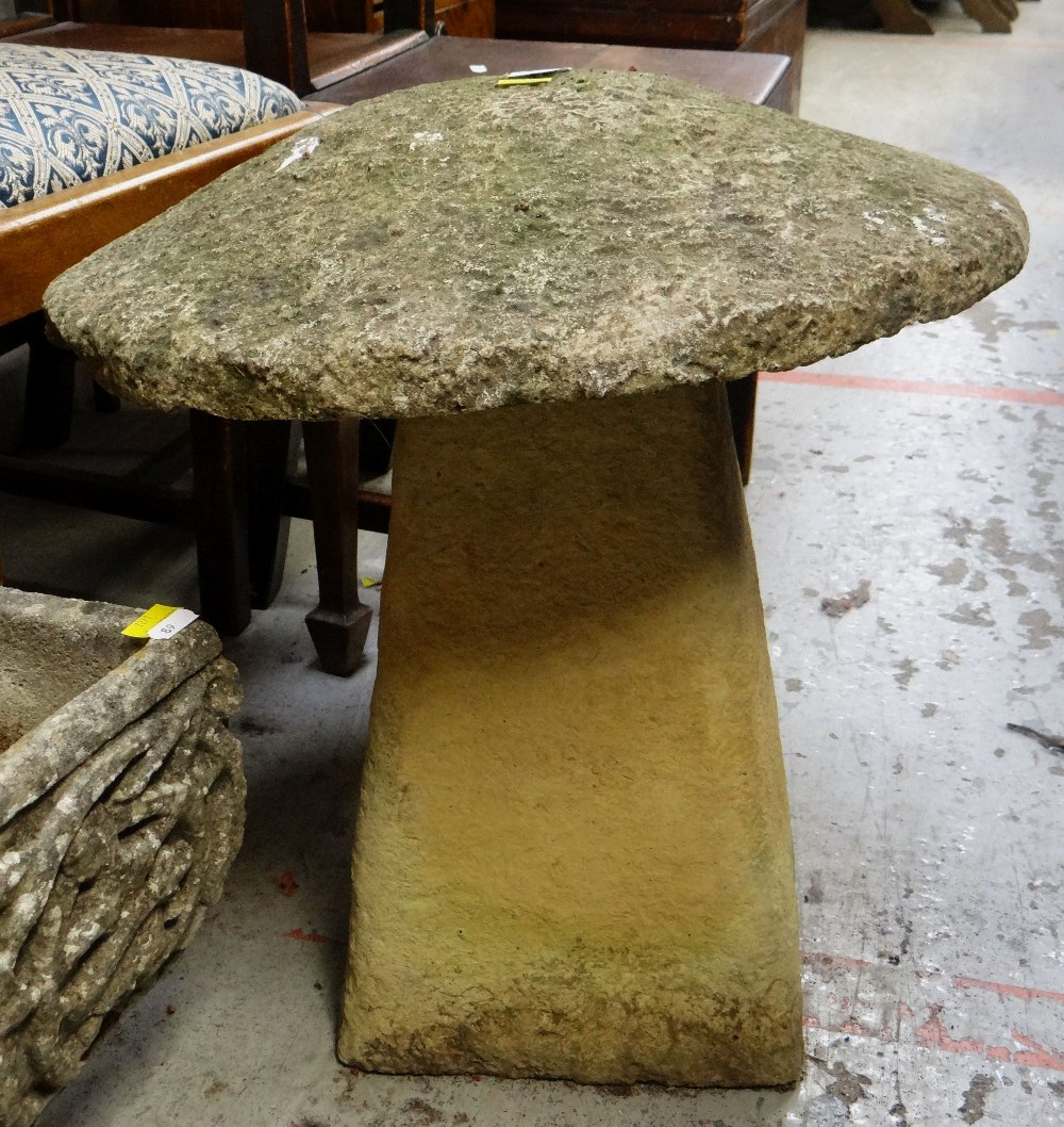 ANTIQUE COMPOSITION STADDLE STONE, 51cms high