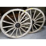 PAIR OF VINTAGE BLACK & WHITE PAINTED WAGON WHEELS, 72cms diam. (2)