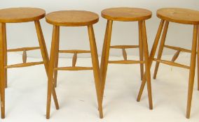 SET OF FOUR ERCOL-STYLE ELM & BEECH BAR STOOLS, tall legs joined by H-stretchers (4)