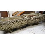 PAIR OF RECTANGULAR COMPOSITION GARDEN PLANTERS with stylized floral decoration, 54 x 30cms (2)
