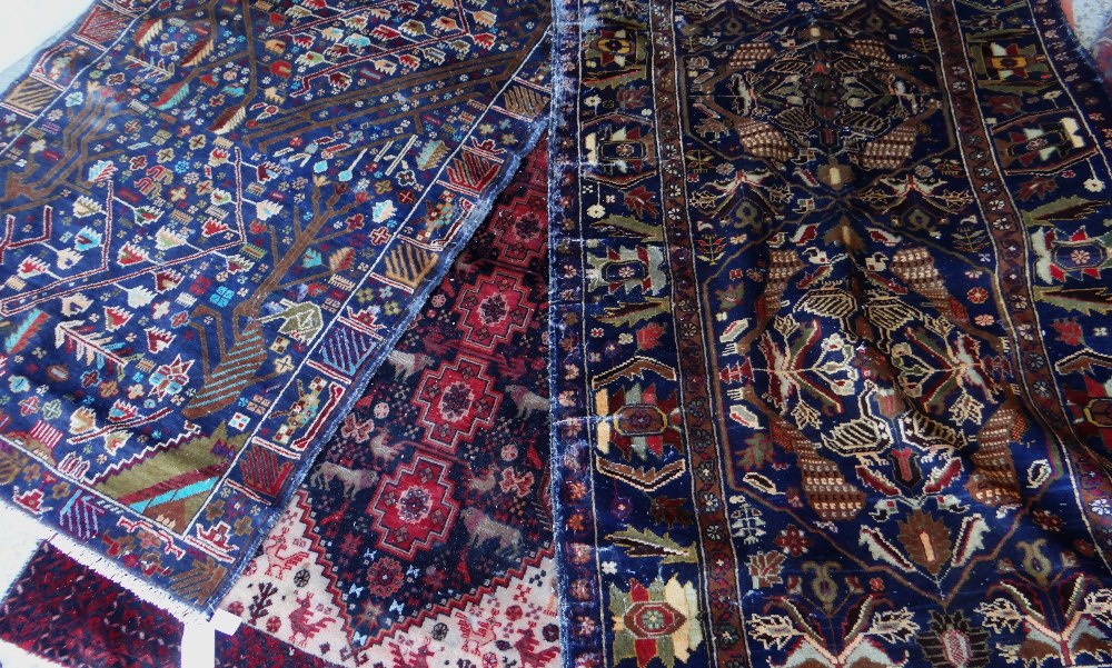 ASSORTED TRIBAL RUGS including Baluch pictorial rug, all approx 210 x 130cms (3) Condition Report: