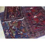 THREE AFGHAN PICTORIAL RUGS including a townscape, possibly Kabul, largest 196 x 145cms (3)