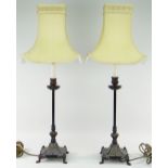 PAIR OF CAST METAL CANDLESTICK TABLE LAMPS with ivory silk shades, overall 74cms high (2)