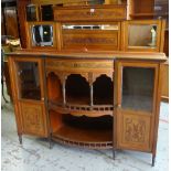 EDWARDIAN WALNUT MIRROR BACK SIDEBOARD, floral carved tops and central bow front with spindles and