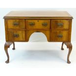QUEEN ANNE-STYLE WALNUT DESK, fitted five drawers around an arched kneehole, carved cabriole legs,