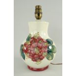 WALTER MOORCROFT POTTERY LAMP BASE, red Hibiscus pattern, 22cms high (fitted for electricity)
