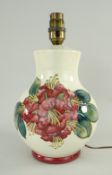 WALTER MOORCROFT POTTERY LAMP BASE, red Hibiscus pattern, 22cms high (fitted for electricity)