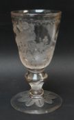 19TH CENTURY ENGRAVED GLASS GOBLET decorated with six putti on seesaws and beside grapevine above