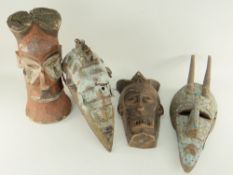 TWO MARKA MASKS each with cut aluminium decoration, 54cms and two Tchokwe masks, 43 & 39cms high (