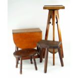 ARTS & CRAFTS-STYLE OAK TRIPOD FERN STAND together with two small milking stools (3)