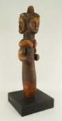 FANG RELIQUARY GUARDIAN FIGURE with three faces, 51cms high