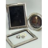 THREE SILVER PHOTOGRAPH FRAMES, miniature trophy cup and acorn shaped baby teether with ring (5)