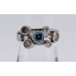 PLATINUM DIAMOND SEVEN-STONE RING (one blue, three brown, three white), 6.8gms