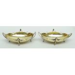 PAIR OF EDWARD VII SILVER OVAL BON BON DISHES, having four whiplash handles terminating in hoof