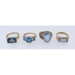 FOUR 9CT YELLOW GOLD RINGS SET WITH SEMI-PRECIOUS BLUE STONES, 15.5gms (4)