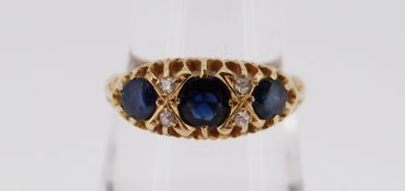 18CT THREE-STONE SAPPHIRE DIAMOND CHIP RING, size N/O, 2.8gms