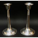 PAIR OF GEORGE V SILVER CIRCULAR TAPERING CANDLESTICKS (loaded), Birmingham 1910 (2).