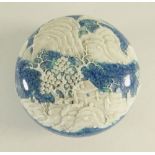 CHINESE ROBIN'S EGG PORCELAIN, circular paste box and cover, with moulded landscape decoration to