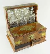 VICTORIAN BRASS BOUND WALNUT BOX TANTALUS, c. 1880, containing three cut glass spirit decanters