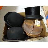 VINTAGE CHRISTY'S TOP HAT IN LEATHER HAT BOX, two other bowler hats and a riding hat (4) Provenance: