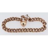 9CT GOLD CURB LINK BRACELET with heart-shaped padlock, 13.6gms