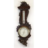 OAK CASED ANEROID BAROMETER, white porcelain dial signed Benetfink, Cheapside, London, rococo carved