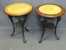 TWO CAST IRON PUB TABLES, reproduction with 59cms diameter mahogany and faux marble effect tops on