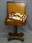 REGENCY ROSEWOOD NEEDLEWORK TABLE with brass escutcheon and lion mask ring handles on a segmented