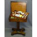 REGENCY ROSEWOOD NEEDLEWORK TABLE with brass escutcheon and lion mask ring handles on a segmented