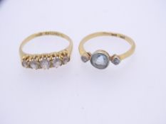 TWO 18CT GOLD DRESS RINGS, one set with central, possibly sky blue topaz, flanked by two small