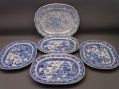 FIVE BLUE & WHITE POTTERY MEAT PLATTERS to include four Willow pattern, 40cms across and one Asiatic