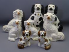 STAFFORDSHIRE POTTERY SEATED SPANIELS, four pairs, 40cms H the tallest