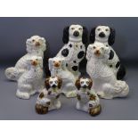 STAFFORDSHIRE POTTERY SEATED SPANIELS, four pairs, 40cms H the tallest