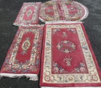 FIVE CHINESE WASHED WOOLLEN SCATTER RUGS to include a tassel ended rectangular example, 152 x 90cms,